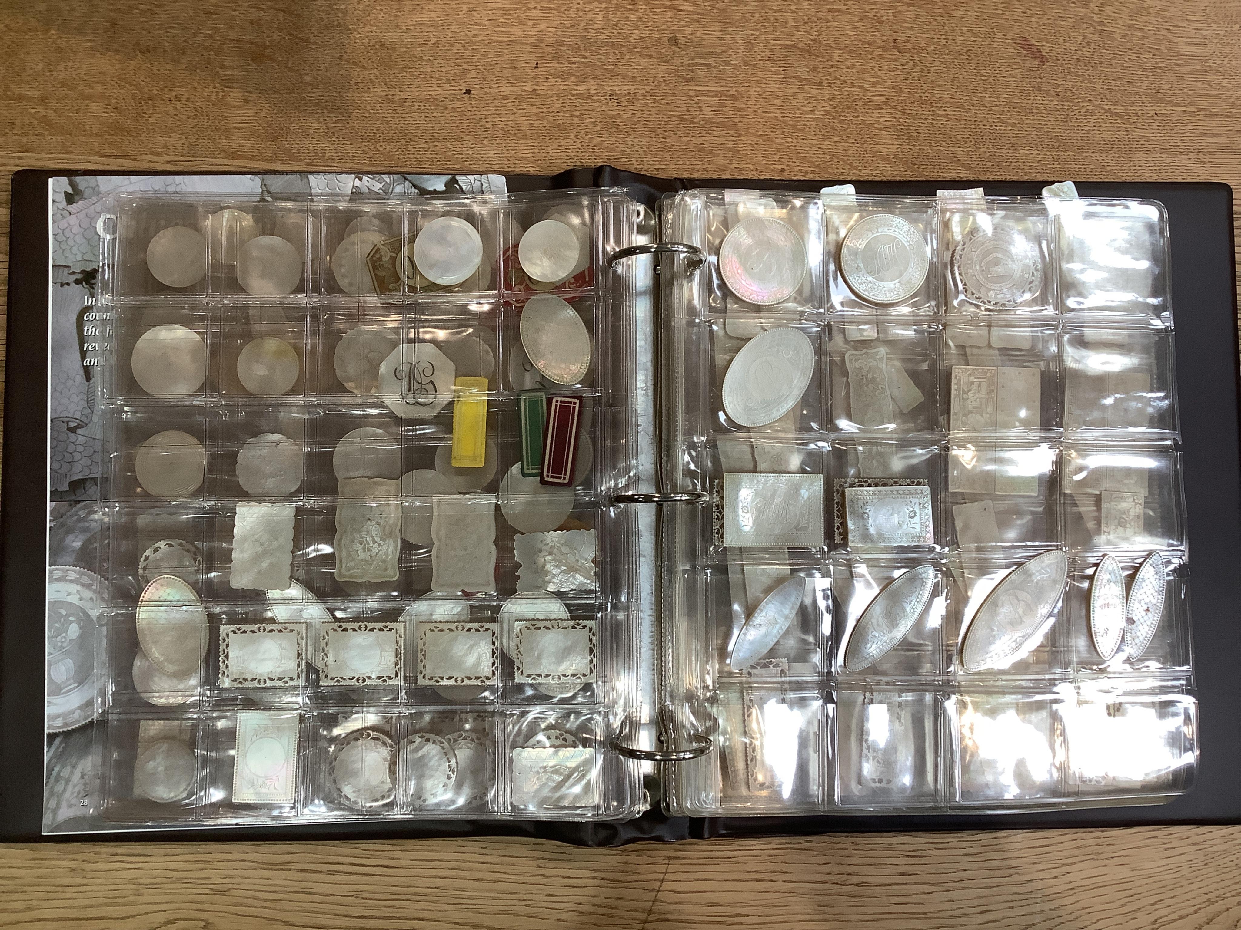 An extensive collection of Chinese mother of pearl gaming counters, in an album. Condition - the majority of the counters in good condition, occasional examples with tiny splinter edge chips